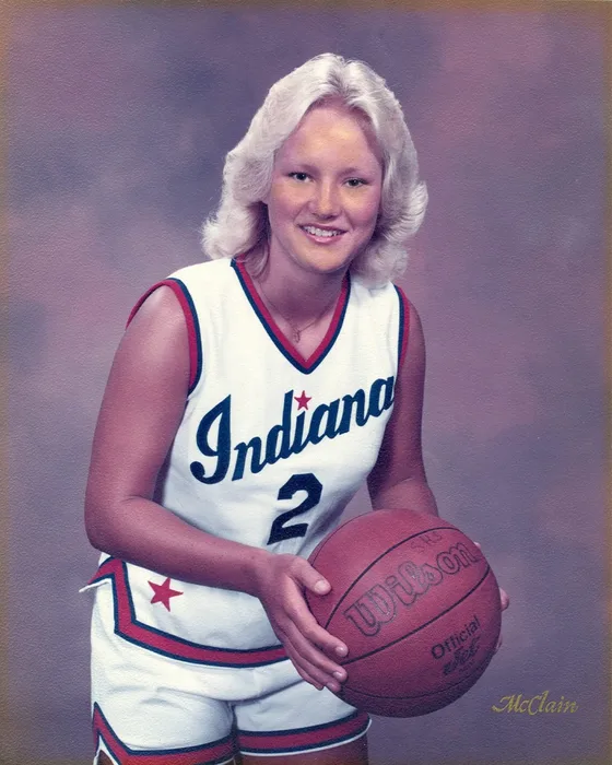 Roxanne Cox in her Indiana All-Stars No. 2 uniform, holding a basketball