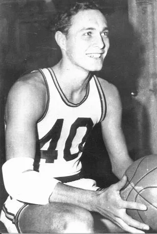 Bill James in his Scottsburg No. 40 jersey, holding a basketball