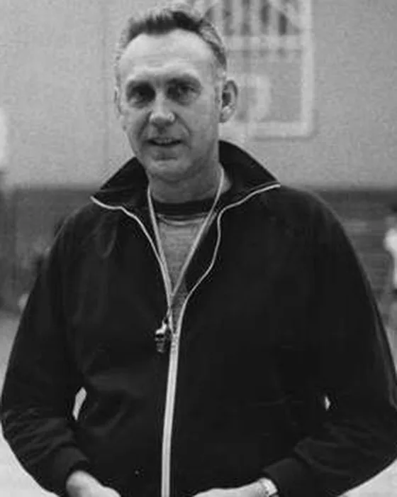 Bill Ritter in later years, in a dark track jacket in a gym