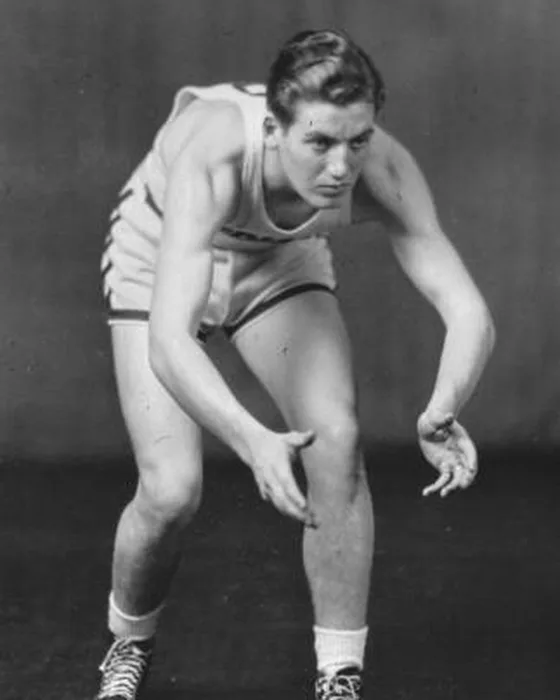 Woody Weir as a young player in a 1930s uniform, crouched and ready on defense